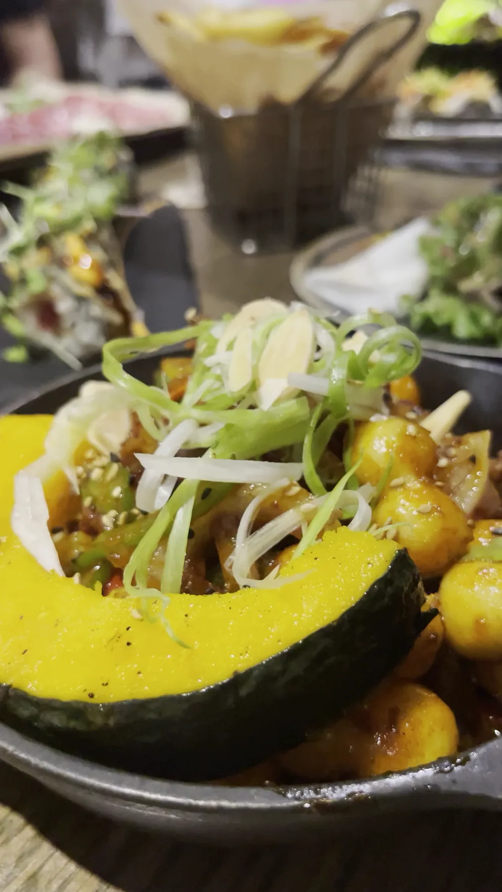 Roasted kabocha squash and golden potatoes in a cast iron skillet